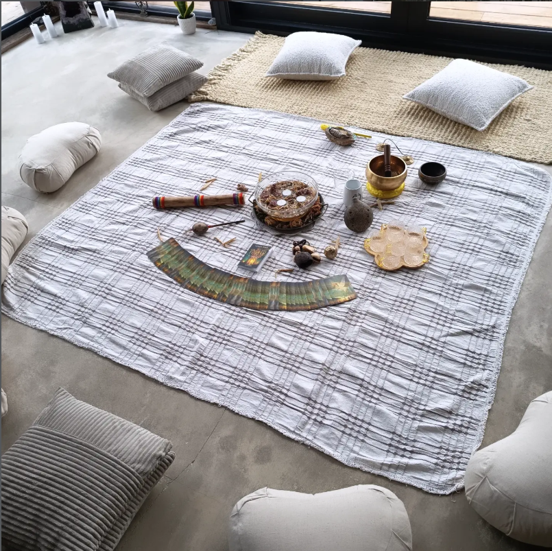 Yoga setup with pillows and blanket