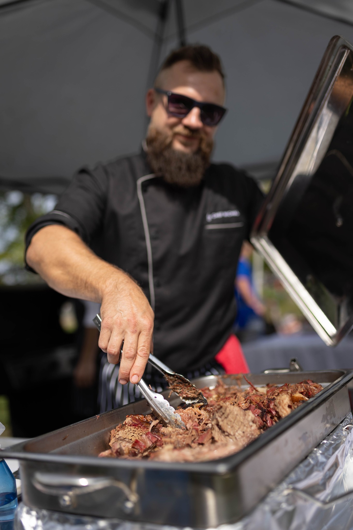 Taste of Tweed Chef Michael turning beef in a hot plate