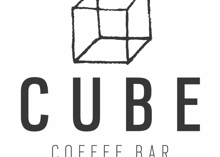 transparent cube, coffee bar name, black writing on white background