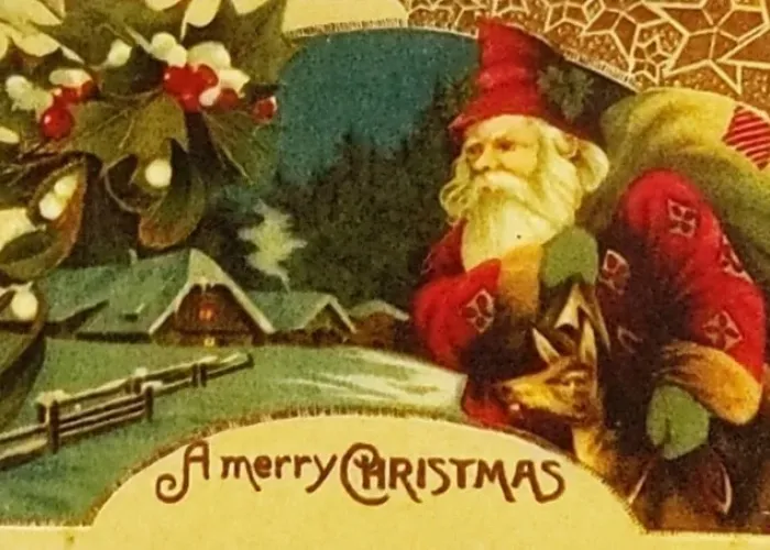 Old style post card image, "a merry christmas" in red writing, santa in red holding a sack over his shoulder, houses covered in snow in background
